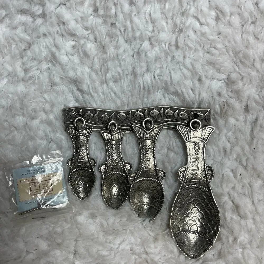 Vintage Tin Woodsman TWpewter set of four Fish measuring spoons with wall hanger